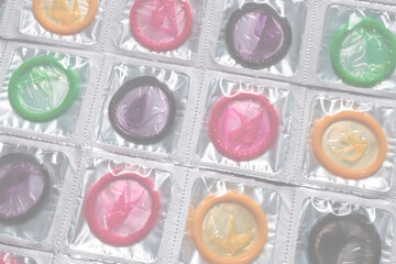Colorful condoms background.