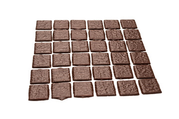 Dark chocolate candies isolated on white background.