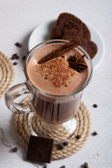 Coffee foam is poured into a mug with oat milk. Making latte. Vertical orientation