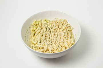 Boiled instant noodles on a white background. Fast food. Modern food.