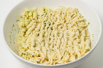 Boiled instant noodles on a white background. Fast food. Modern food.