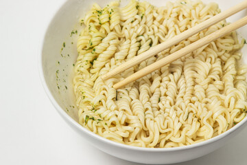 Boiled instant noodles on a white background. Fast food. Modern food.