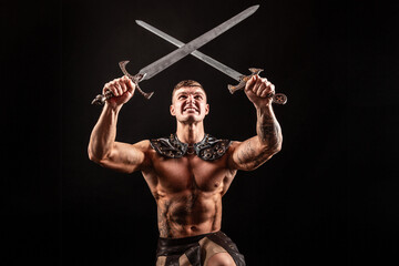 Fototapeta na wymiar Antique warrior with sword against dark background