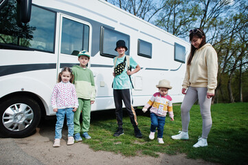 Mother with four children travel at motorhome RV camper van.