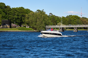 Fototapeta na wymiar Photo of a yacht sailing on the river