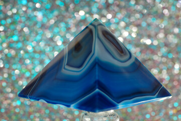 Blue violet pyramid of agate with quartz inclusions or worked as a disc