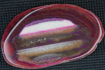 Blue violet pyramid of agate with quartz inclusions or worked as a disc