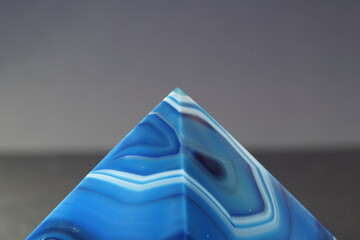 Blue violet pyramid of agate with quartz inclusions or worked as a disc