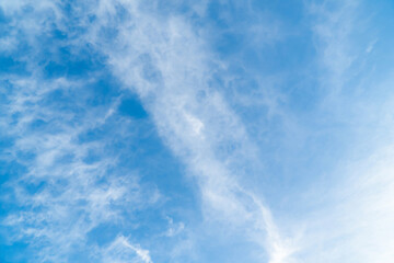 Clean on a hot summer day. Fresh blue sky and soft white clouds. Bright blue sky with fluffy white clouds, The idea for the feeling of fresh weather, Bright blue sky with fluffy white clouds.