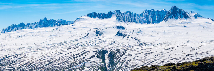 Broad high definition view of majestic and jagged mountains of Thompson Pass near Valdez in Alaska