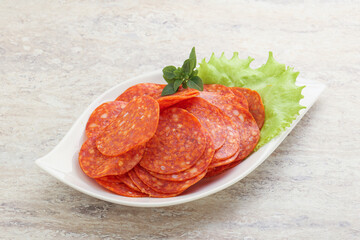 Sliced pepperoni sausage in the bowl