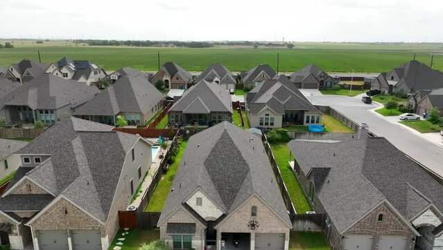 Rising aerial of new single family homes in suburban residential development in Southern USA.