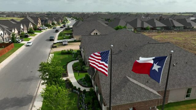 Housing in Texas. New residential neighborhood community with single family houses. Homes in large development. Population growth in Southern USA theme. Rising aerial reveal.