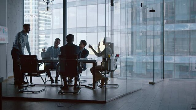 Applause for young financial analyst after presentation about business strategy in meeting room
