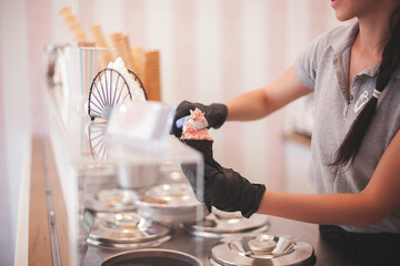 Process of making ice cream. Professional ice cream dessert making in cafeteria. Ice cream equipment.