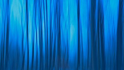 Abstract background blur in shades of blue through intentional camera movement