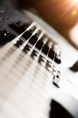 close up black electric guitar on black background concept