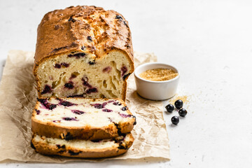 Black currant tea loaf cake. Copy space.
