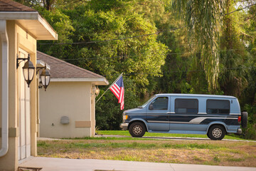 Classical americal van parked in front of a house. USA travel concept