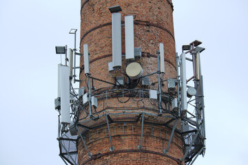 Closeup and detailed view of various GPS, cellphone, 3G, 4G and 5G equipped telecommunication tower