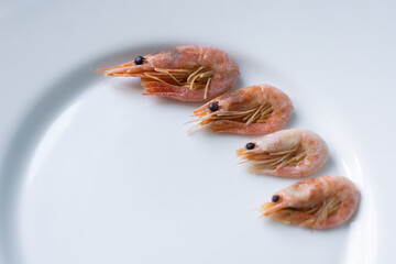 Juicy pink shrimp lying on a plate