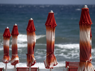 summer sun umbrellas on liguria beach