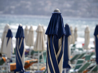 summer sun umbrellas on liguria beach