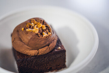 chocolate brownie with mousse and almond chips