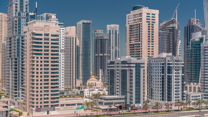 Fototapeta na wymiar Dubai Marina skyline with Mohammad Bin Ahmed Al Mulla mosque aerial timelapse