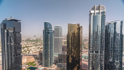 Tall residential buildings at JLT aerial timelapse, part of the Dubai multi commodities centre mixed-use district.