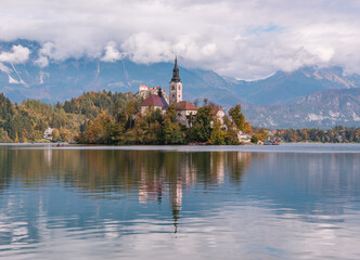 Fototapeta na wymiar Lake Bled with the church on the island and castle on the hill in autumn time.