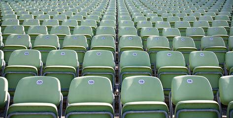 Fototapeta premium Empty Plastic Chairs at the Stadium