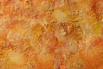 Background picturesque with textured hard brush relief strokes, prints and spots of orange, gold and yellow paint