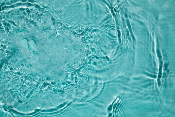 Fototapeta na wymiar Blue ripped water in swimming pool. Top view