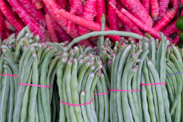 Bean is the seed of one of several genera of the flowering plant family Fabaceae, which are used as vegetables. Vegetables for sale in a market in Territy Bazar, Kolkata, West Bengal, India.