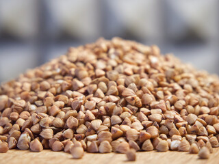 Pile of buckwheat, side view. Buckwheat close-up. Buckwheat for porridge.