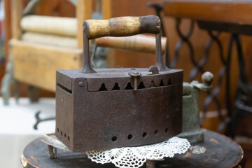 Vintage iron on coals, old, antique things.