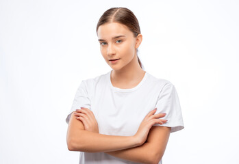 Beautiful young woman with clean skin and a beautiful smile in a white t-shirt. Makeup and healthy clear skin.