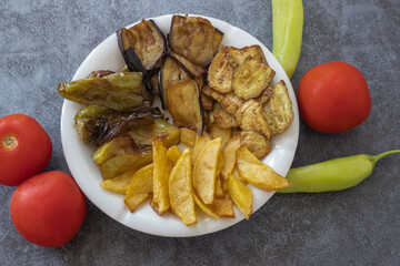 Traditional delicious Turkish food, fried mixed vegetables (potato, zucchini, eggplant, roasted pepper), Turkish name; stir fry vegetables