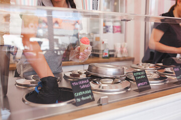 Process of making ice cream. Professional ice cream dessert making in cafeteria. Ice cream equipment.