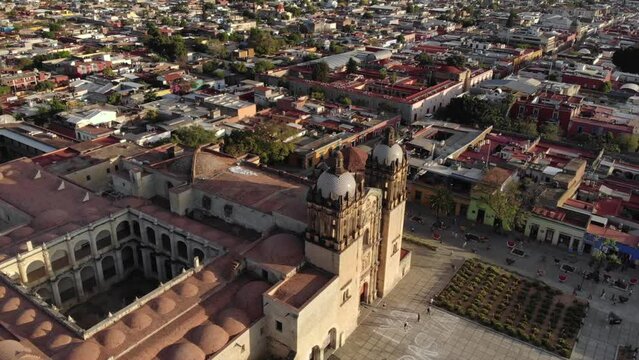 Aerial Shot of Cathedral Templo de Santo Domingo de Guzman is a Baroque ecclesiastical building at sunset in Oaxaca, Mex