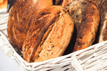 Hand made sourdough bread in white basket in natural daylight, agriculture concept, Slovakia, Europe