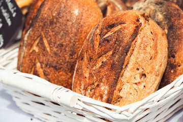 Hand made sourdough bread in white basket in natural daylight, agriculture concept, Slovakia, Europe