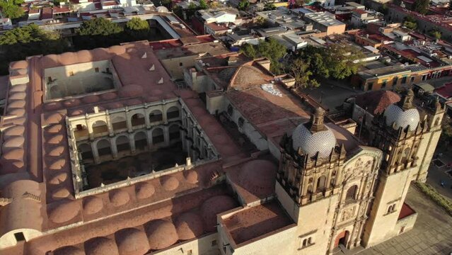 Aerial Shot of Cathedral Templo de Santo Domingo de Guzman is a Baroque ecclesiastical building at sunset in Oaxaca, Mex
