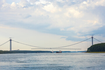 Suspended bridge over danube river, under construction, between Braila and Tulcea cities in Romania.