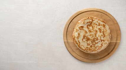 Big pancakes on the table, cooking delicious homemade pancakes