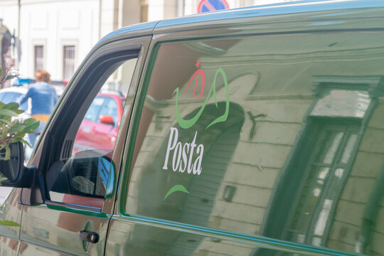 Szombathely, Hungary - June 1, 2022: Logo and sign of Hungarian post (Posta) on green car.