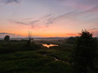 fantastic sunsets over the hills, meadows and forest