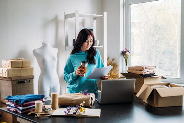 Small business, self employed person, sewing tailoring studio owner. Young fashion designer working