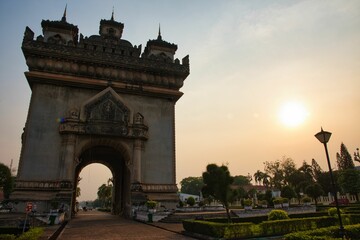 Fototapeta na wymiar Sunrise over the city of Laos, Patuxay park or Monument at Vientiane, Laos. Patuxay monument, capital city of Laos.